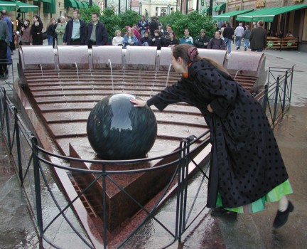 Floating ball in pie-shaped fountain