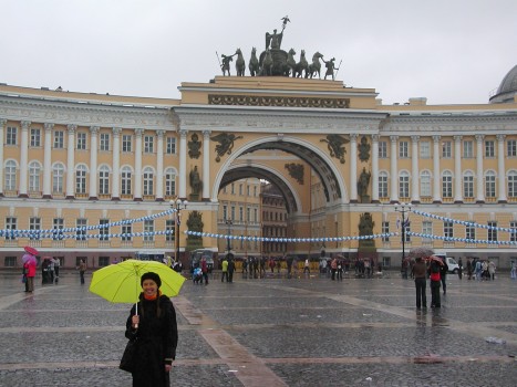 Anya with yellow umbrella at Palace Square