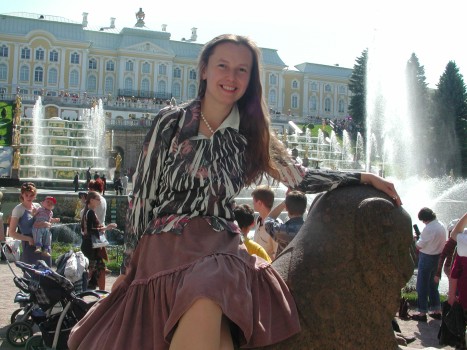 Anya rides a beast in front of Grand Cascade and Grand Palace